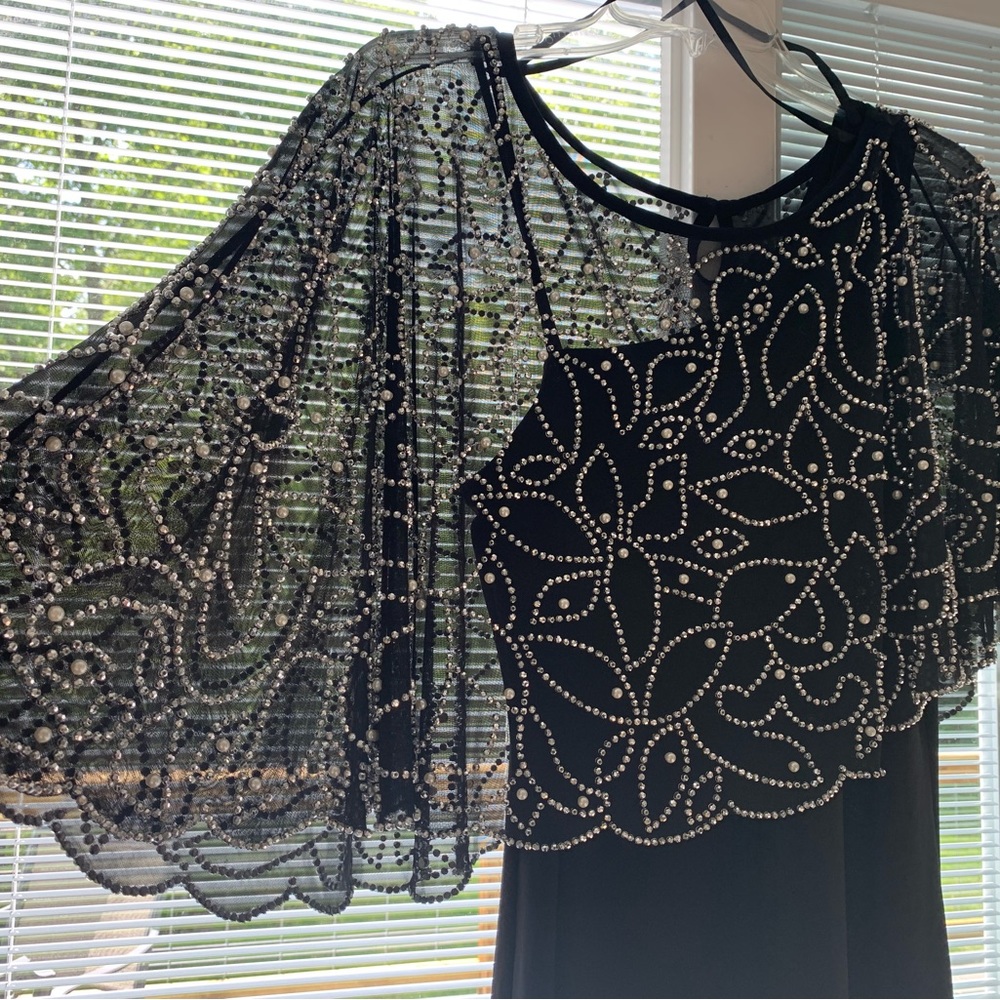 Beautiful black gown with beaded overlay cape.